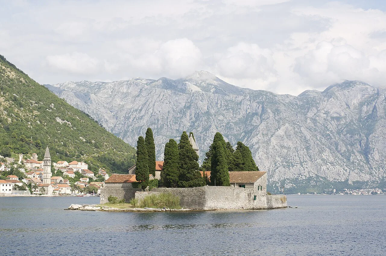 Saint George Island in the Bay of Kotor, with Perast and the mountains behind.