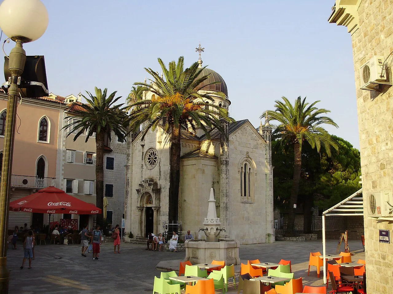 Palm-lined Belavista Square in Herceg Novi's old town, with its domed church.