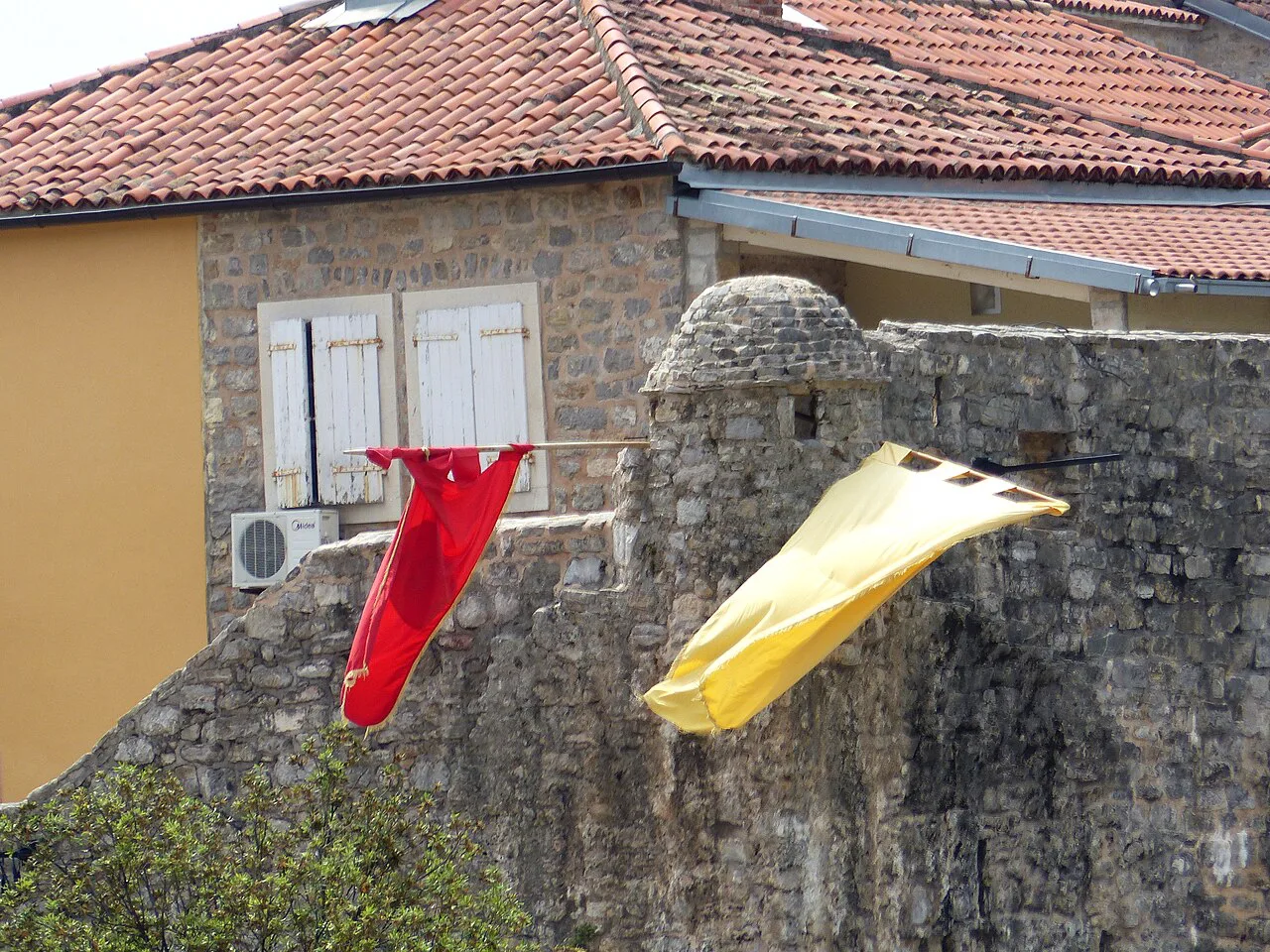 A bastion of Budva's Old Town walls by the harbour.