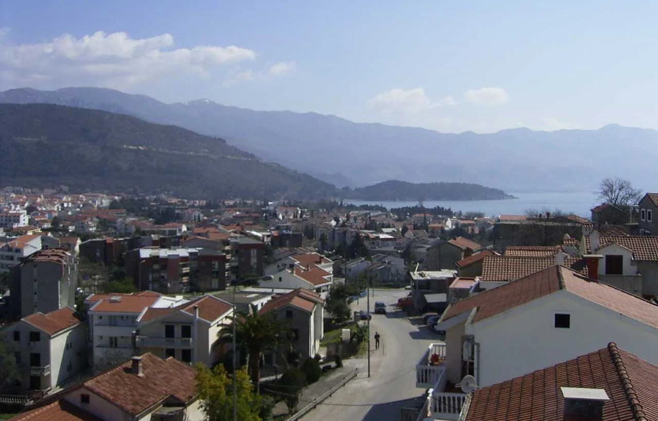 Rooftops of Budva with the bay beyond.