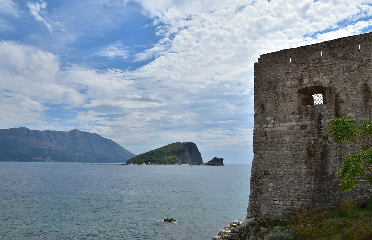 Budva's old town sea walls, with Sveti Nikola island offshore.