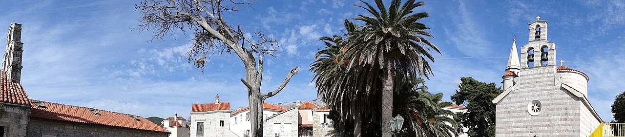 Budva Old Town, with a church bell tower above the rooftops.