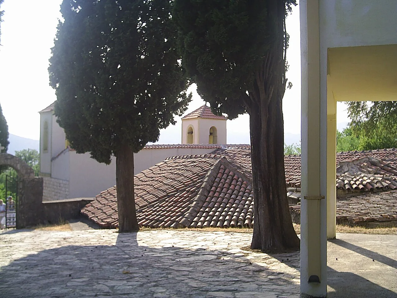 Cypress trees and tiled roofs at Dajbabe Monastery.