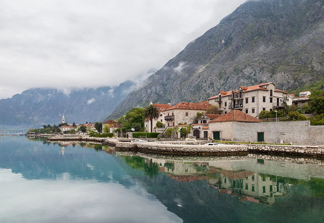 Waterfront houses at Dobrota reflected in the Bay of Kotor.
