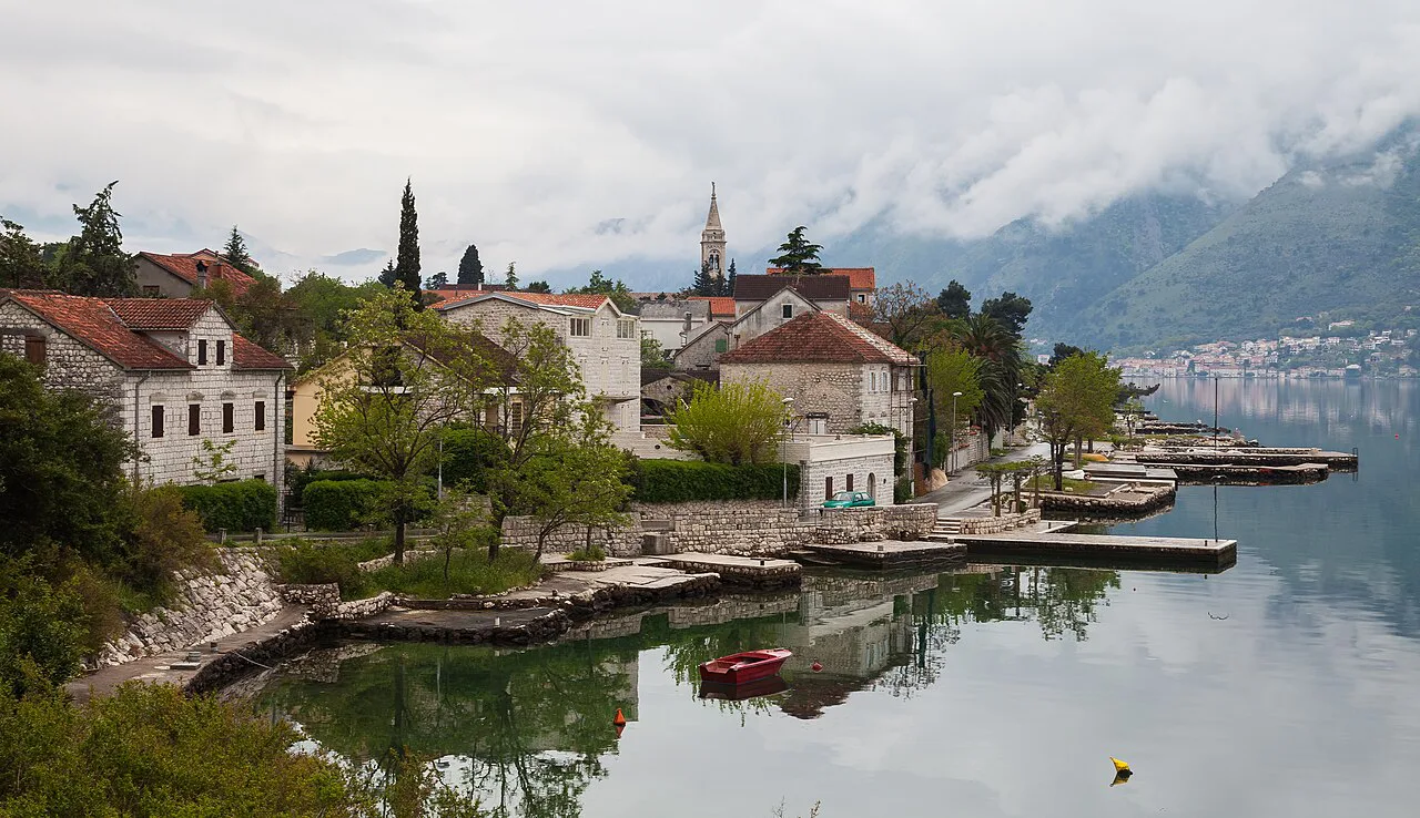 Old stone houses and small quays along the shore at Dobrota.