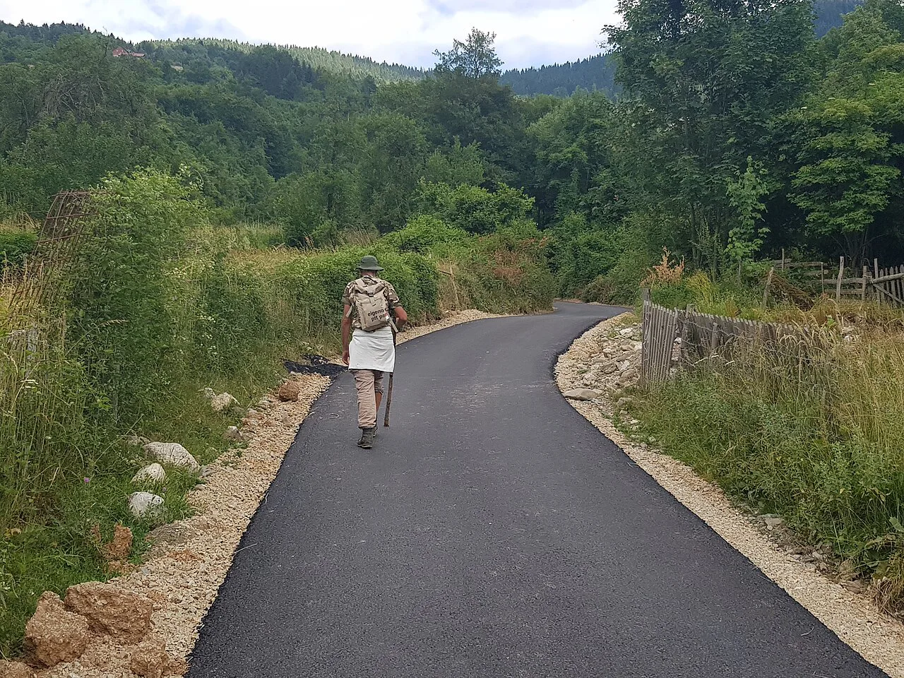 A walking path through the green hills of the Plav area, near Gusinje.