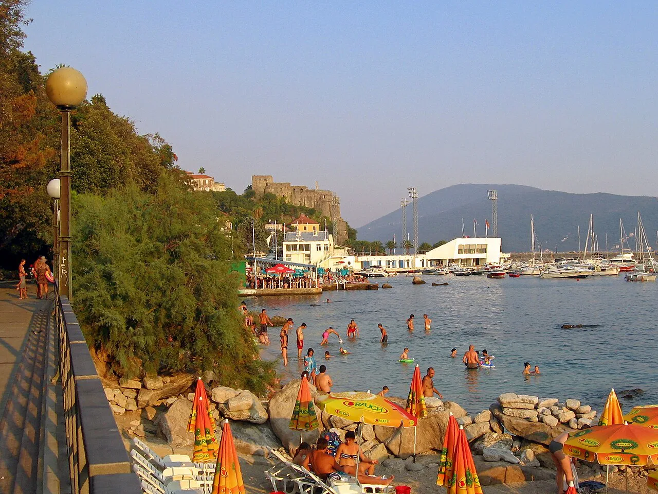 Bathers along the Pet Danica promenade in Herceg Novi.