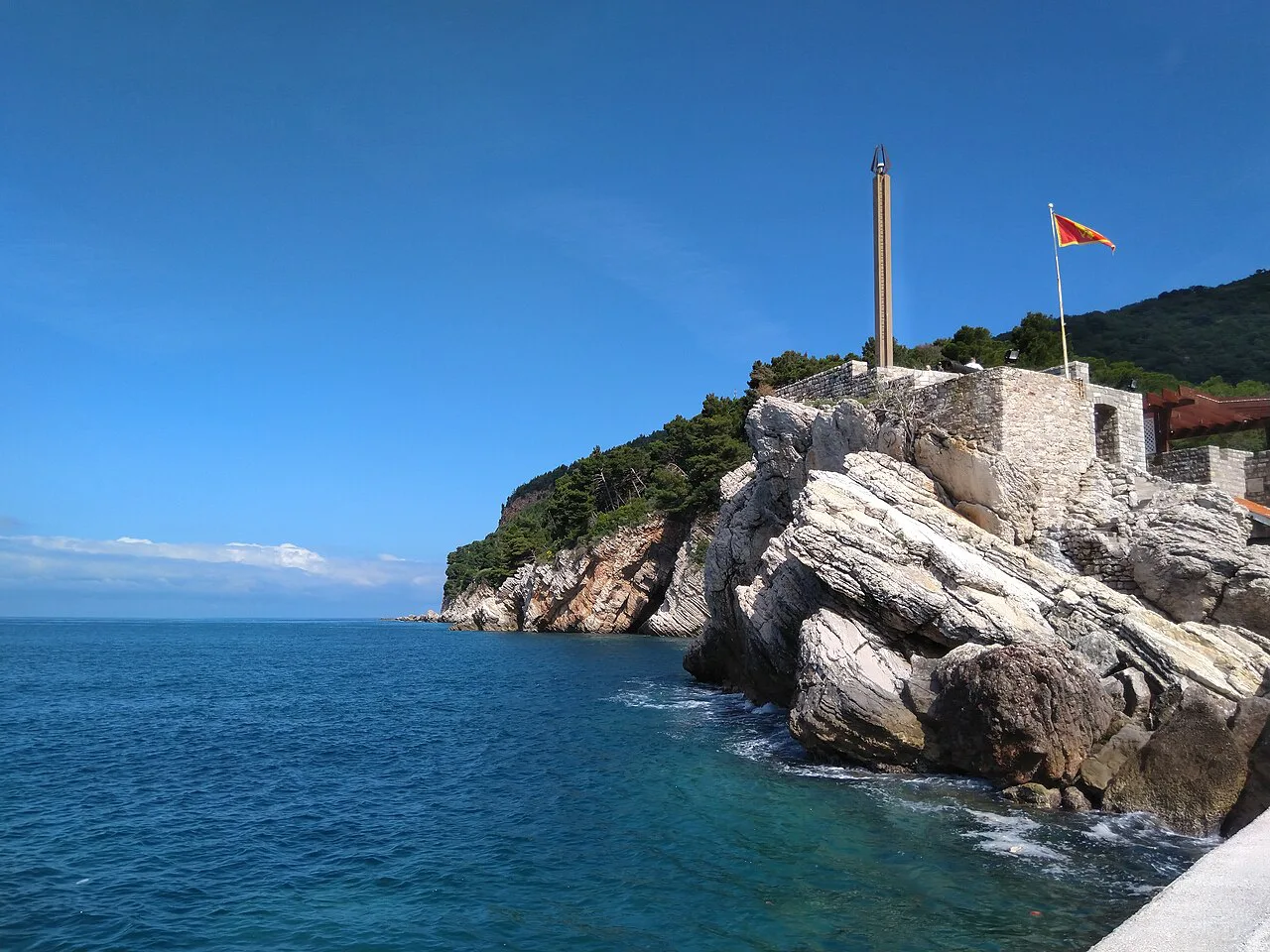 The rocky headland in Petrovac crowned by the walls of the Kastio fortress.