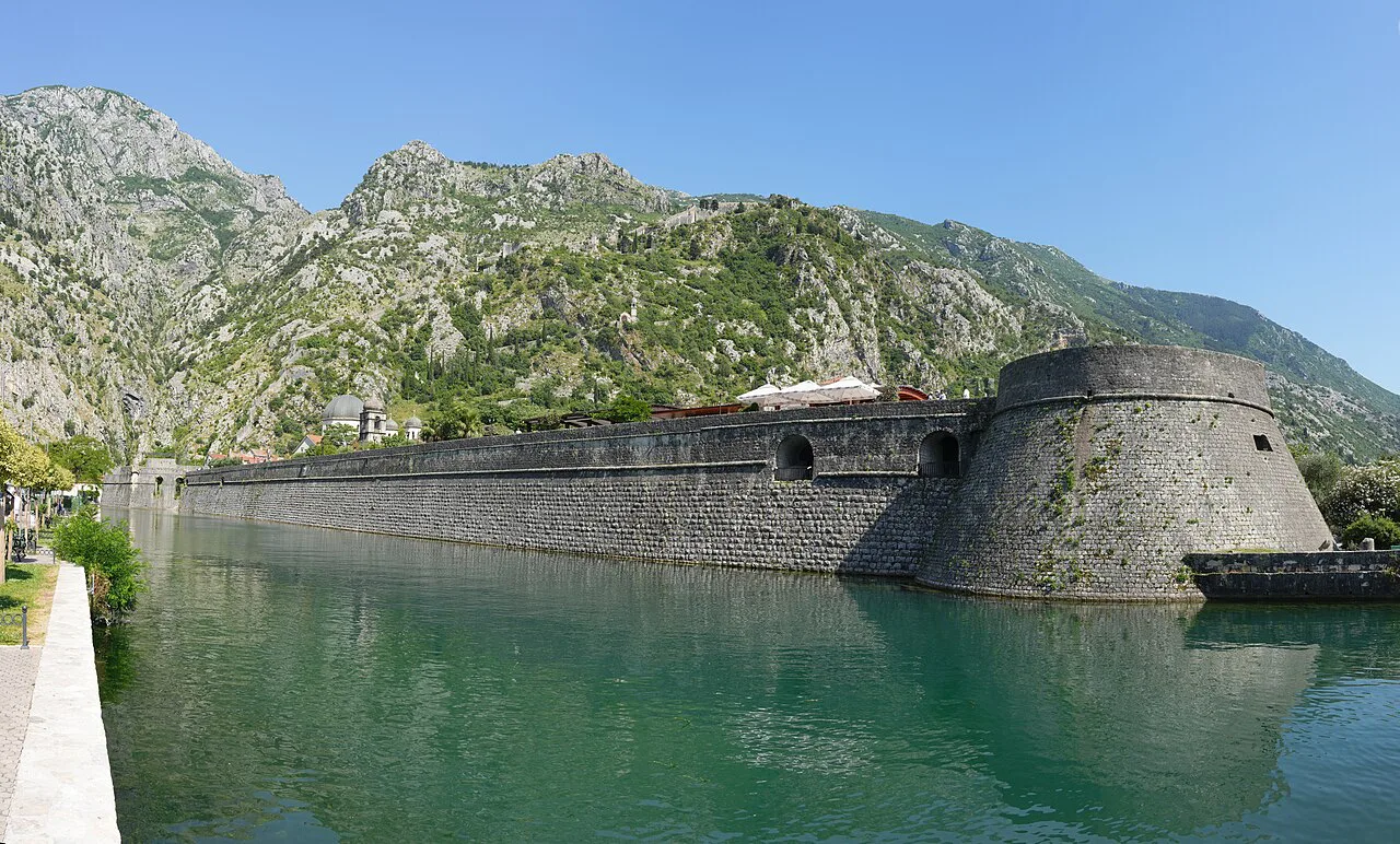 Kotor's city walls and a bastion beside the water.
