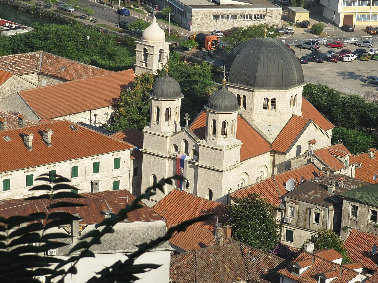 The Church of Saint Nicholas among the rooftops of Kotor Old Town.
