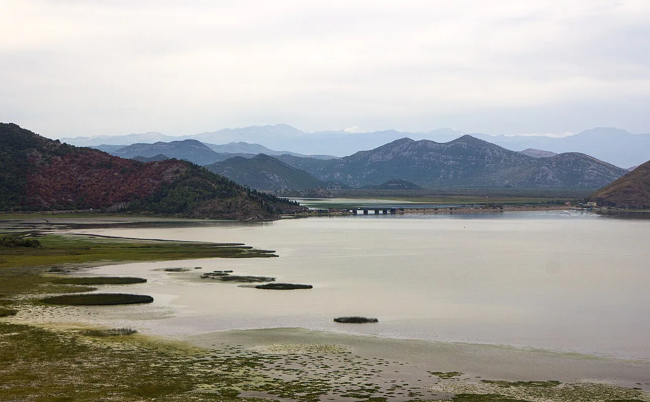 Calm water and mountains on Lake Skadar in September.
