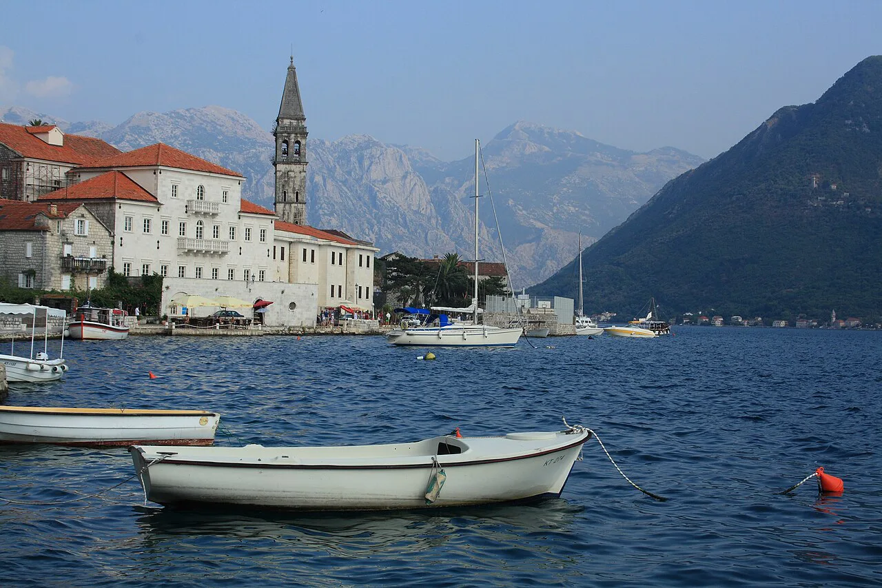 The Perast waterfront with its baroque palaces and the bell tower of St Nicholas.