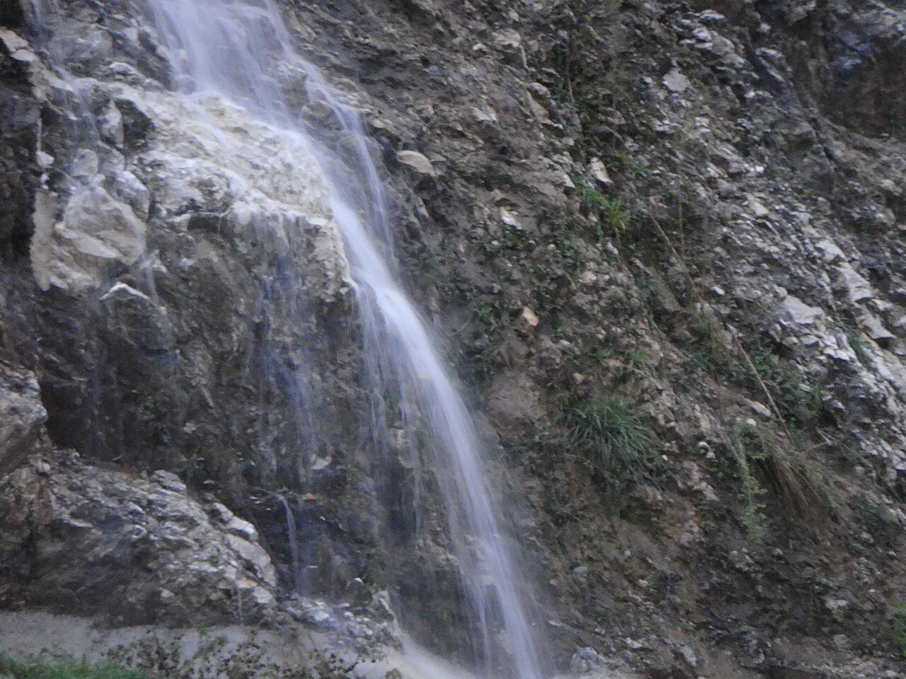 A waterfall tumbling over rocks at Morinj.