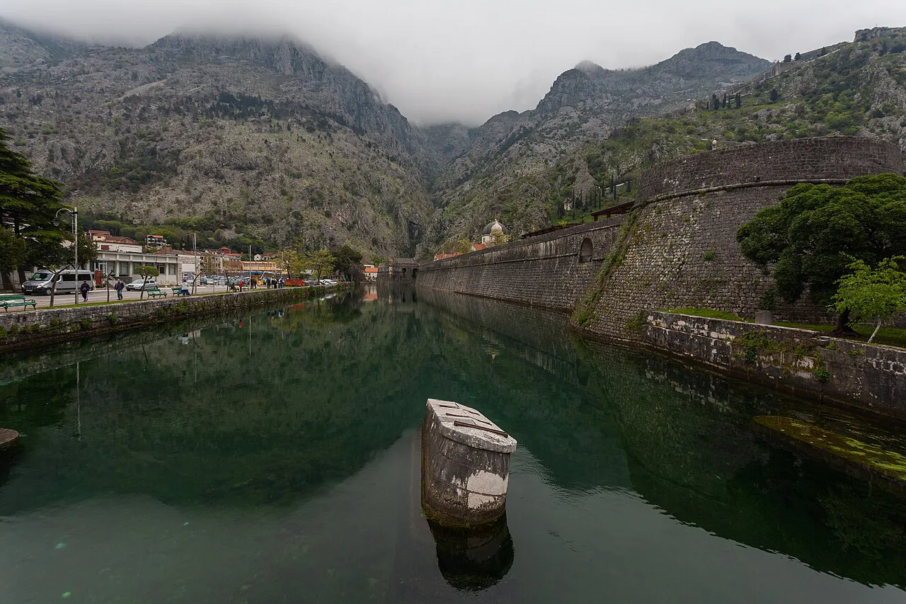 Kotor's town walls reflected in the Škurda river.
