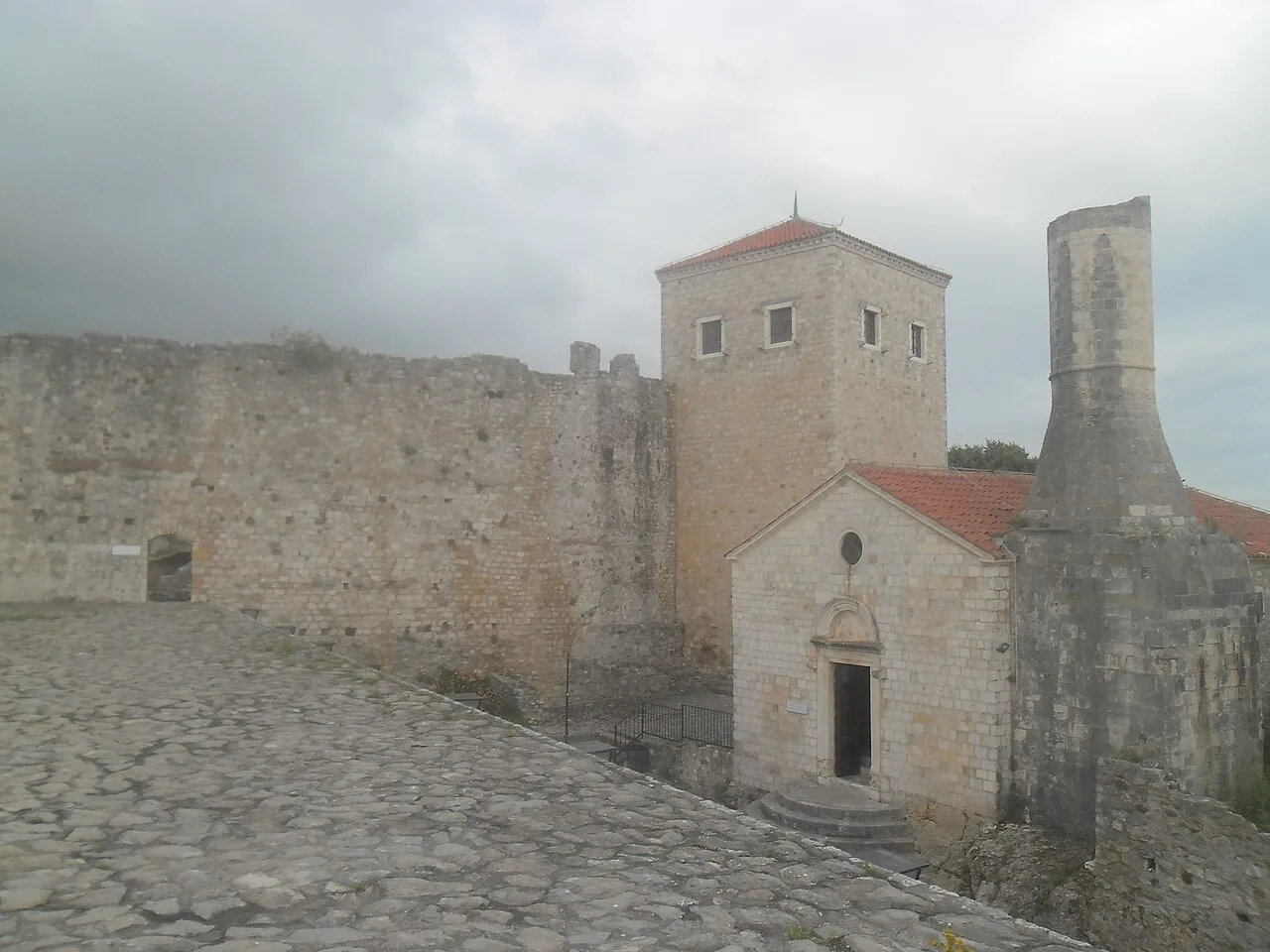 The church-mosque and stone walls of Ulcinj Old Town.