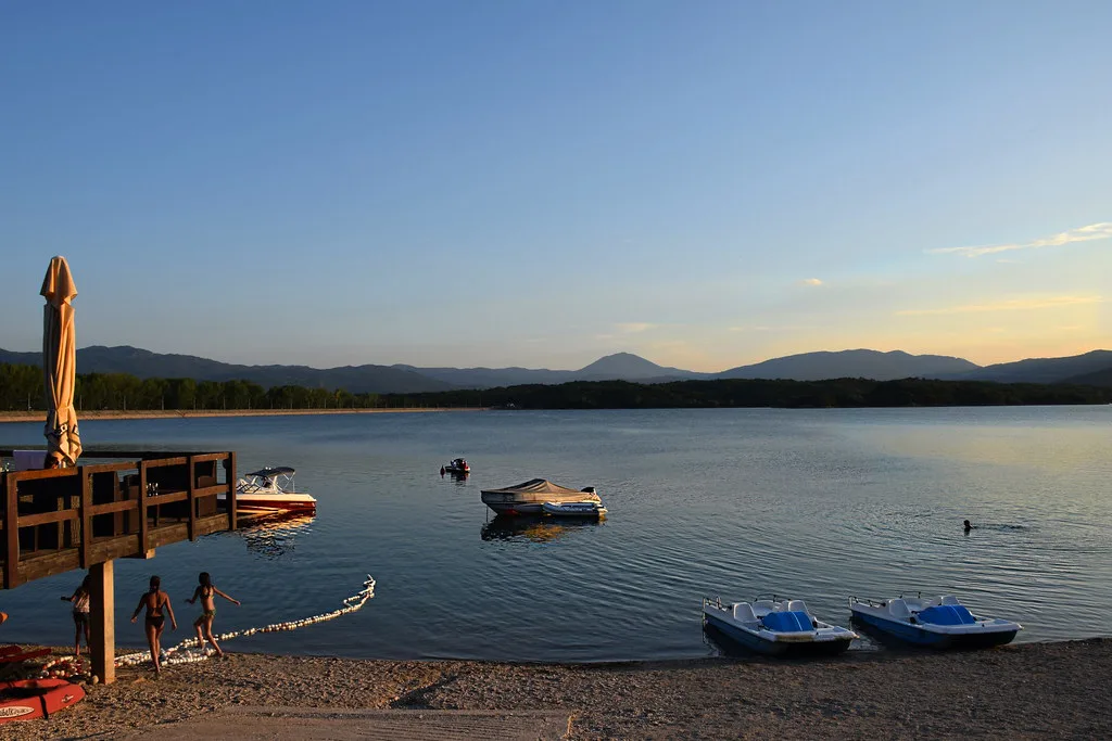 A lakeshore with small boats near Nikšić.