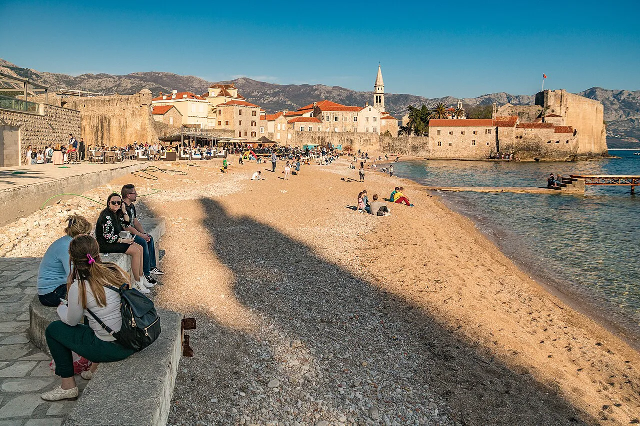 Budva Old Town seen across the beach.
