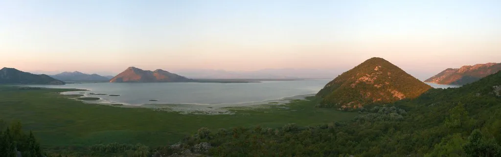 Lake Skadar and its hills at sunset.