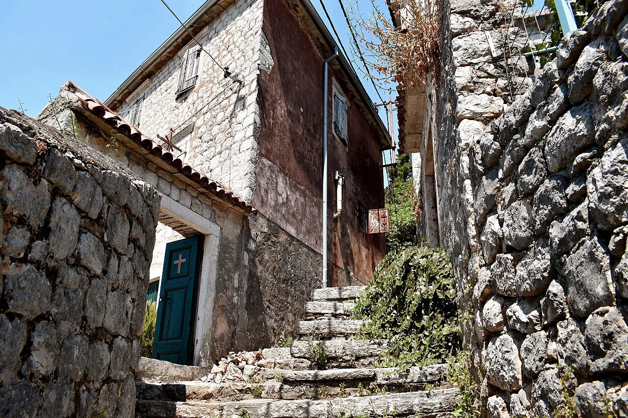 Stone steps leading to the gate of the Orthodox church in Perast.