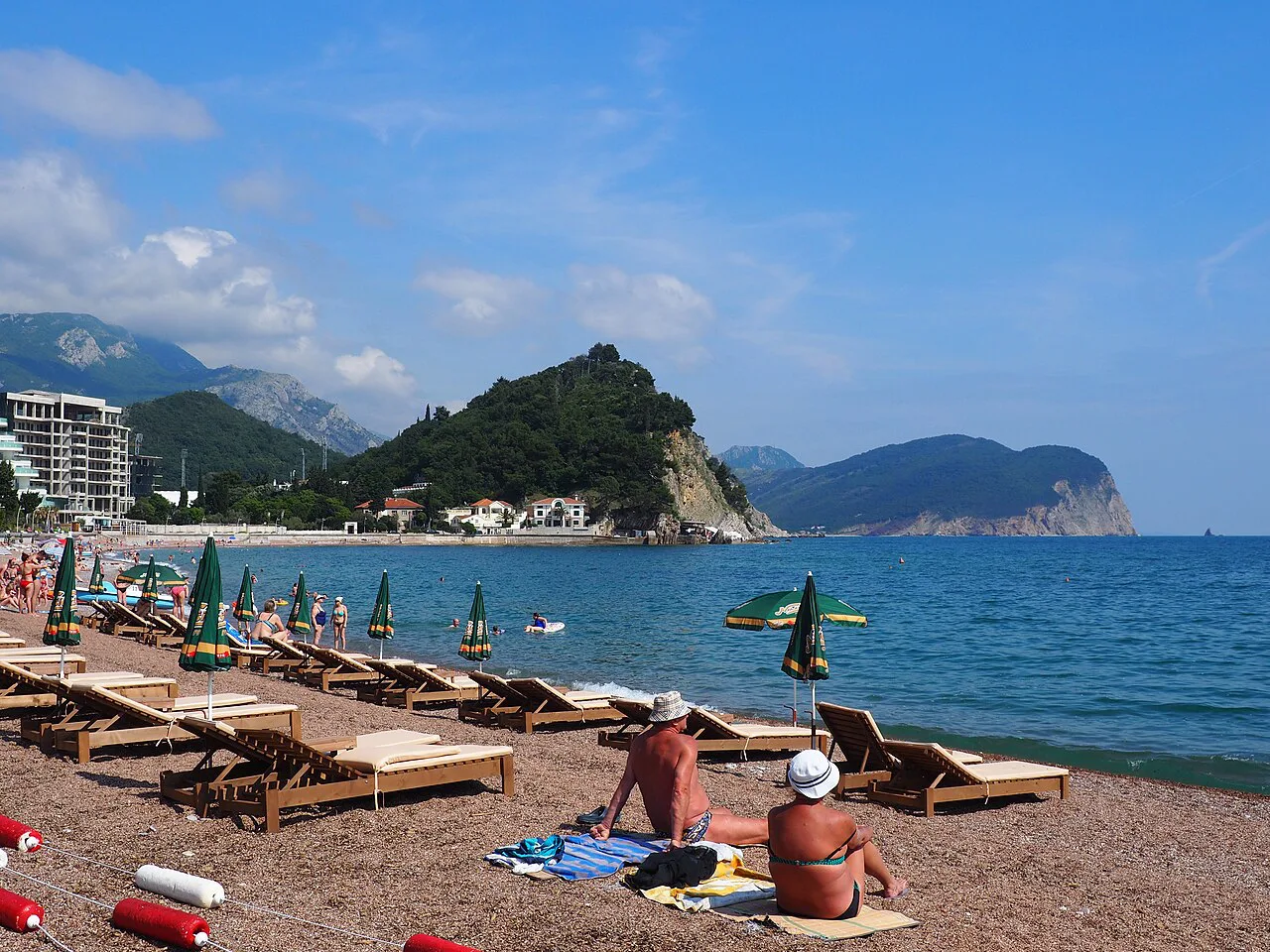 The town beach at Petrovac with the coastline beyond.