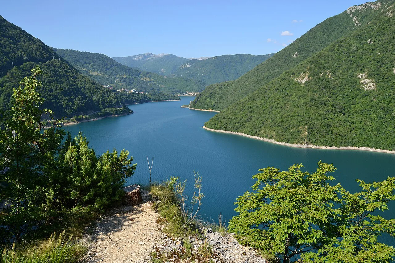 Piva Lake seen from a hillside trail.