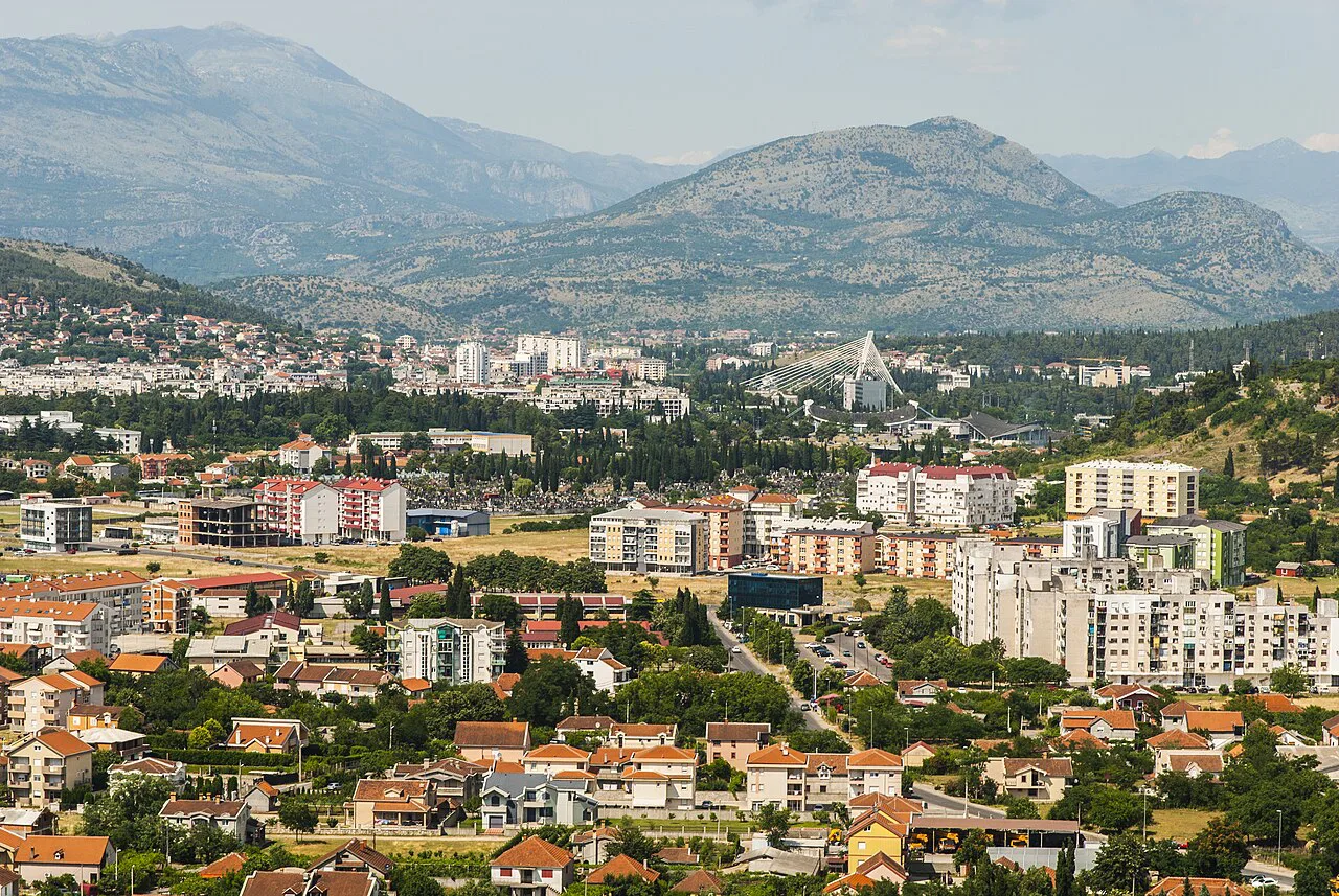 Panoramic view over Podgorica and the surrounding mountains.