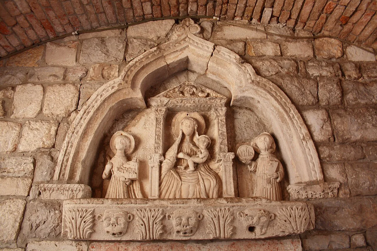 Gothic relief of the Virgin and Child in the passage of Kotor's Sea Gate.
