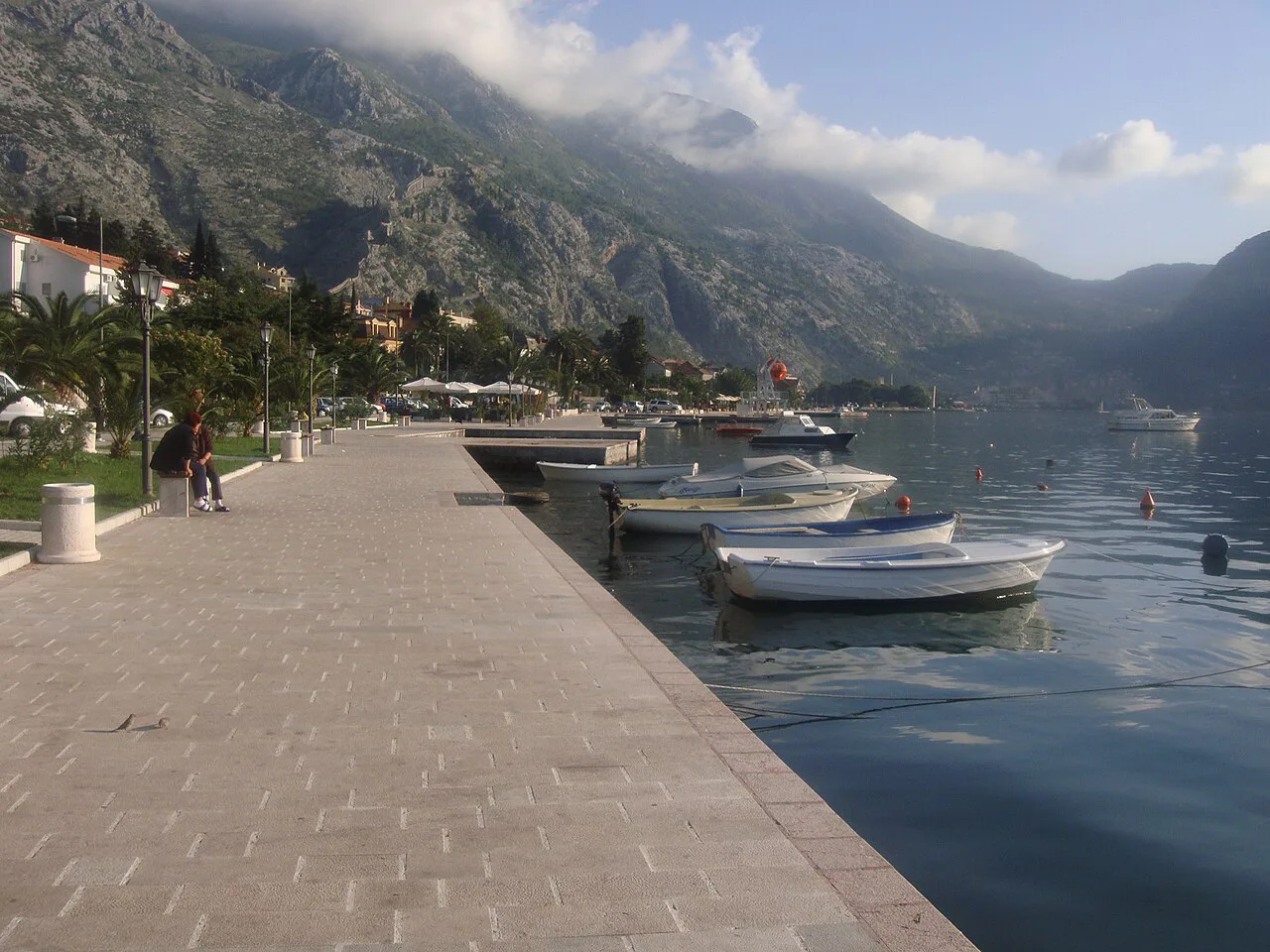 Waterfront promenade and moored boats at Škaljari, Kotor.