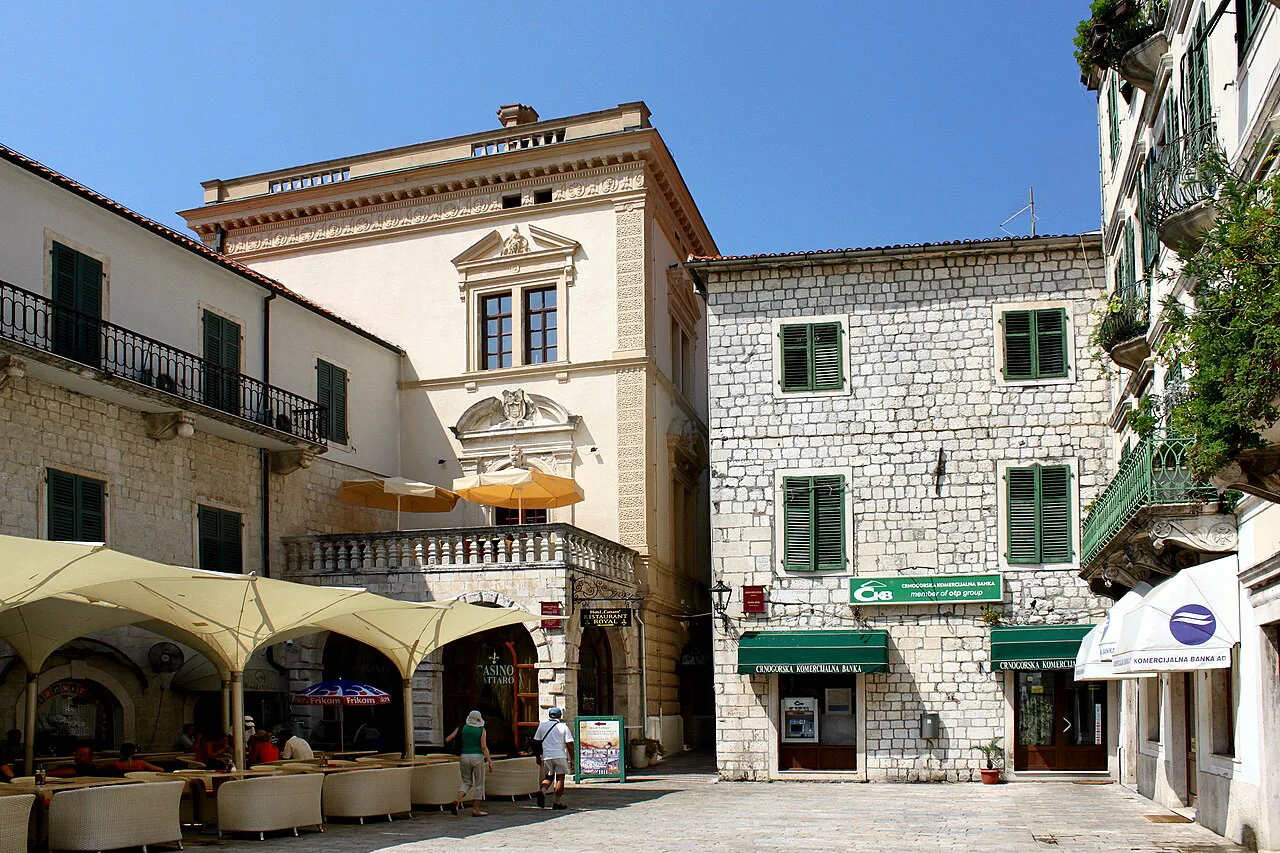 Historic houses and café terraces on the Square of the Arms, Kotor.