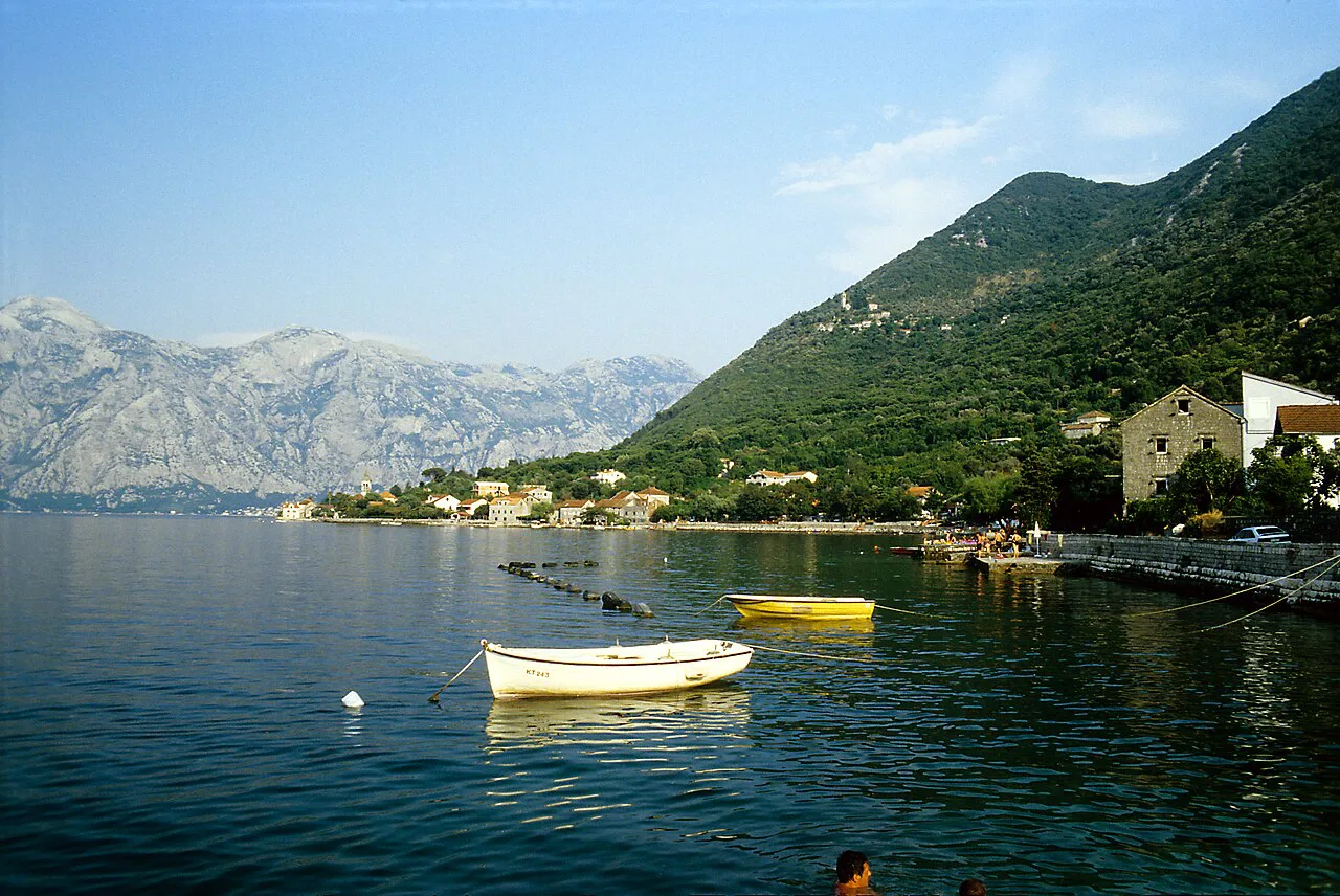 Small boats on the southern shore of the Bay of Kotor near Stoliv.