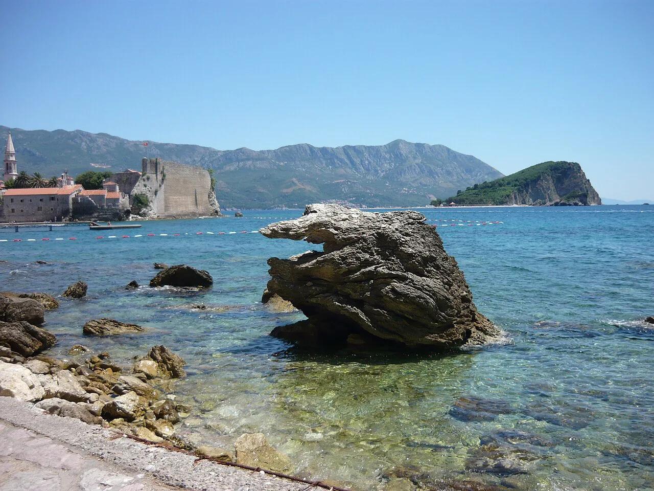 Sveti Nikola island seen from the rocky shore near Budva Old Town.