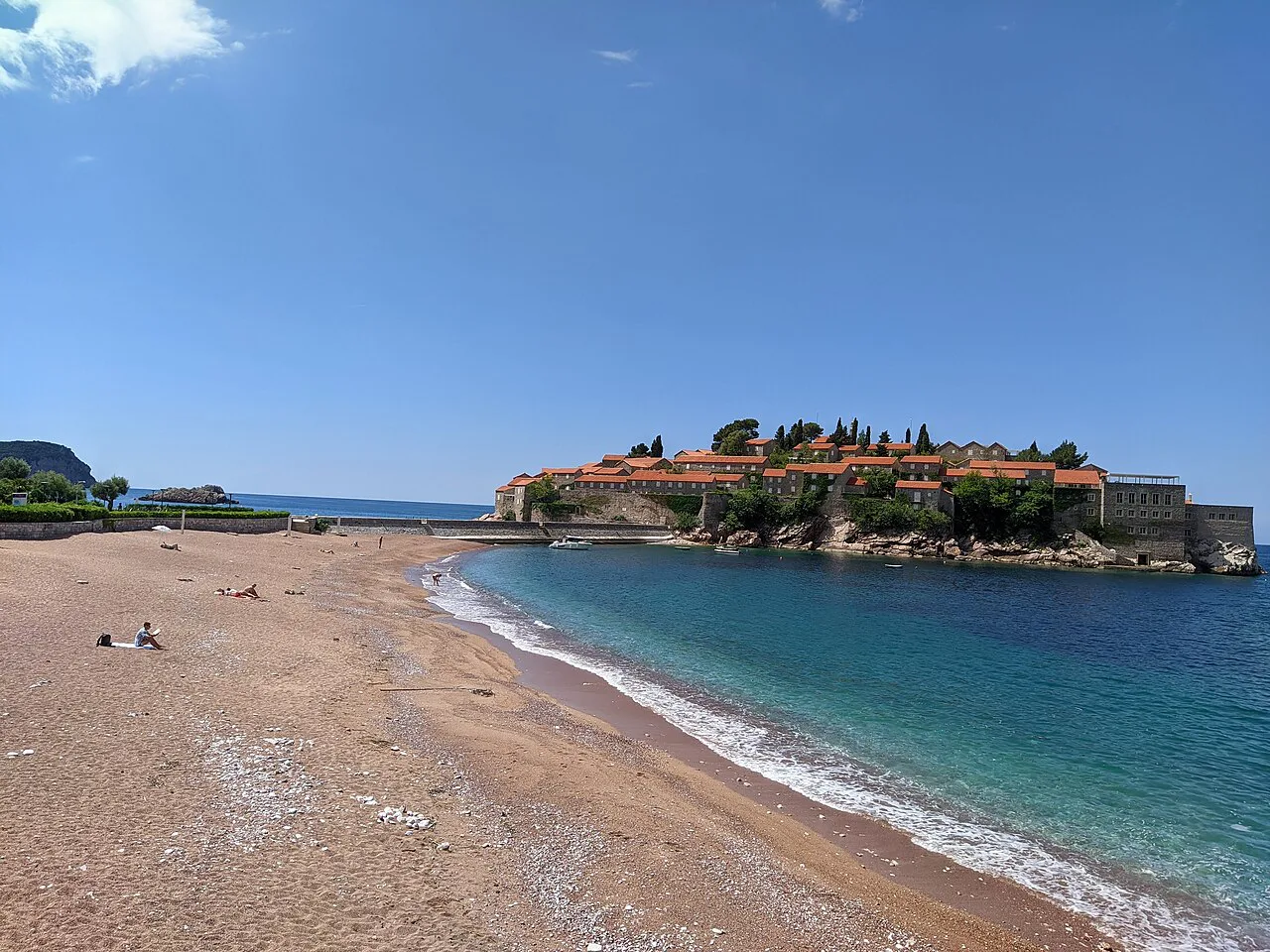 Sveti Stefan island seen across the beach.