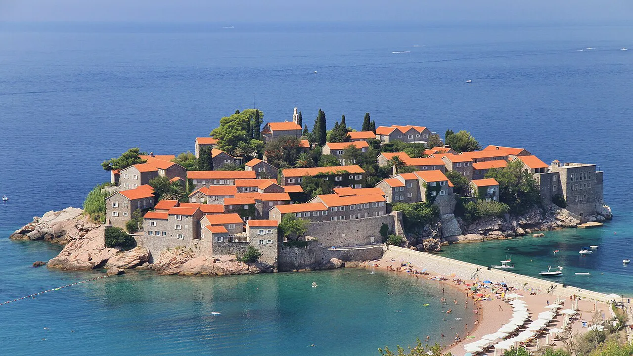 Sveti Stefan islet and its red-roofed village above the Adriatic.