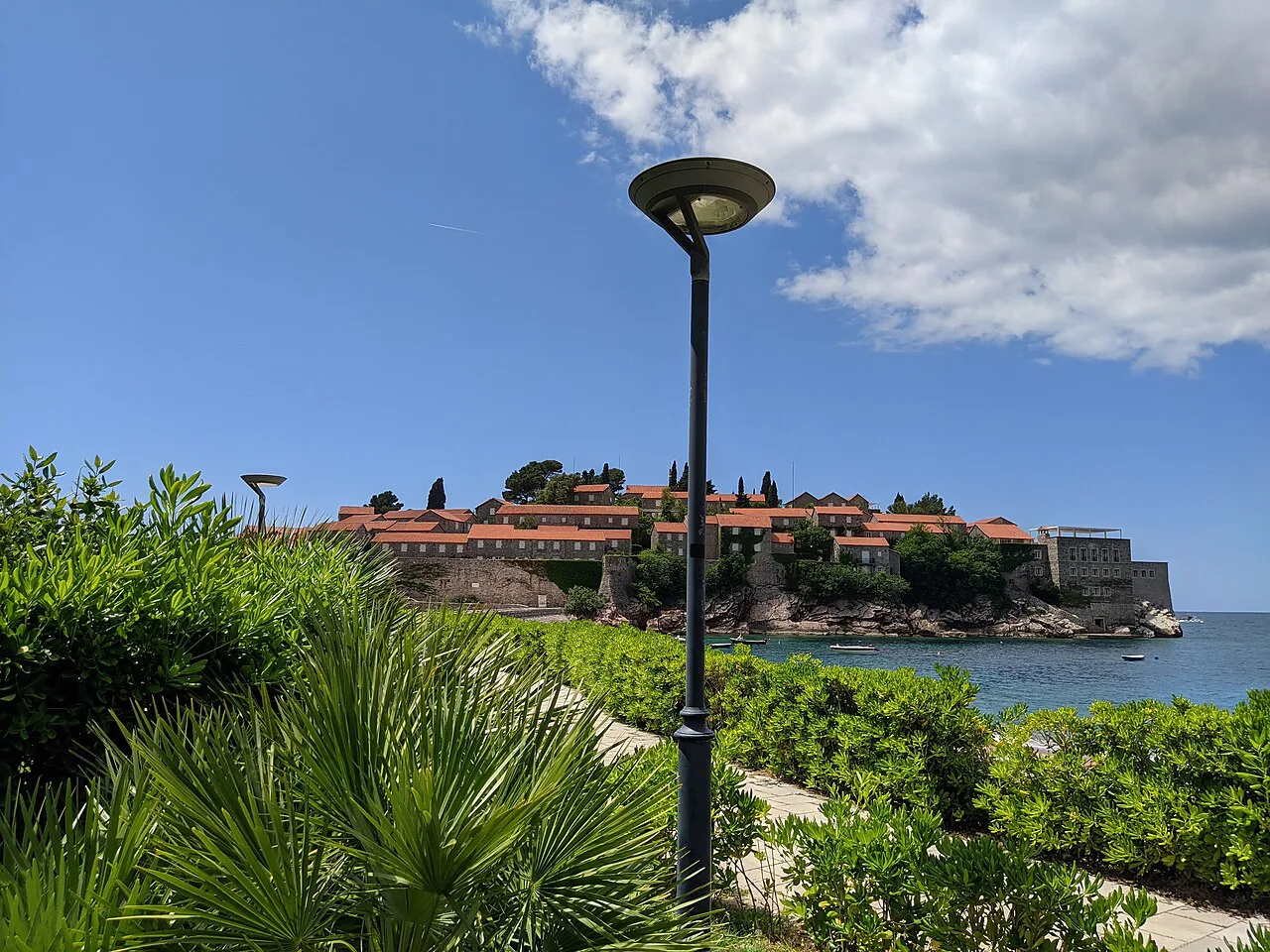 Sveti Stefan island seen from the gardens on the mainland shore.