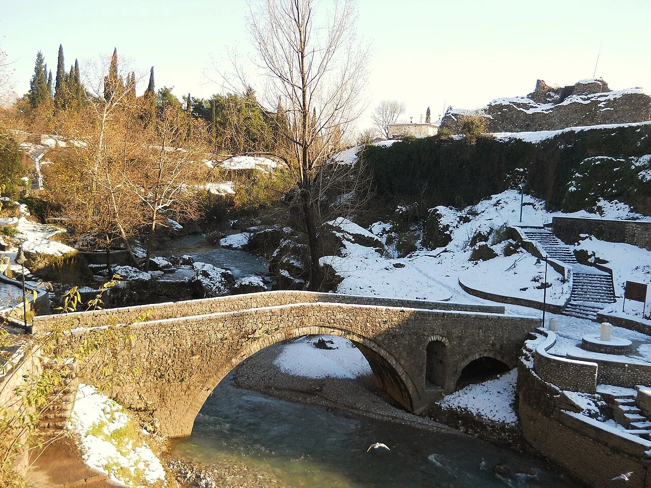 The old stone bridge over the Ribnica river in Podgorica, in winter.