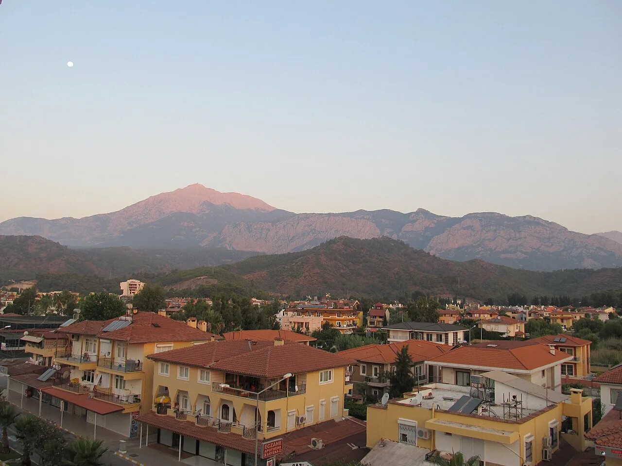 Rooftops of Tivat with mountains beyond.