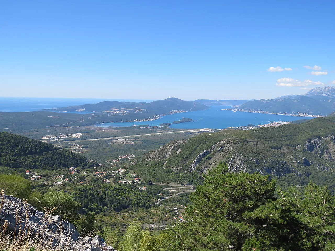Tivat Bay and the runway of Tivat Airport seen from the hills.