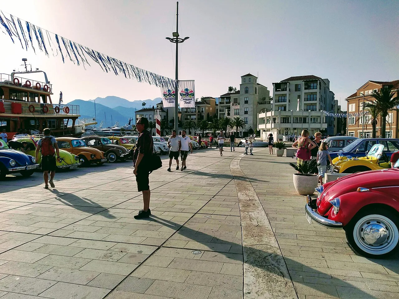 Vintage Volkswagen Beetles on display along the Tivat waterfront during the 2019 carnival.