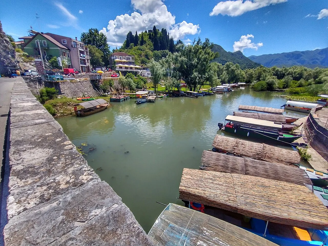 Boats moored on the river at Virpazar, near Lake Skadar.