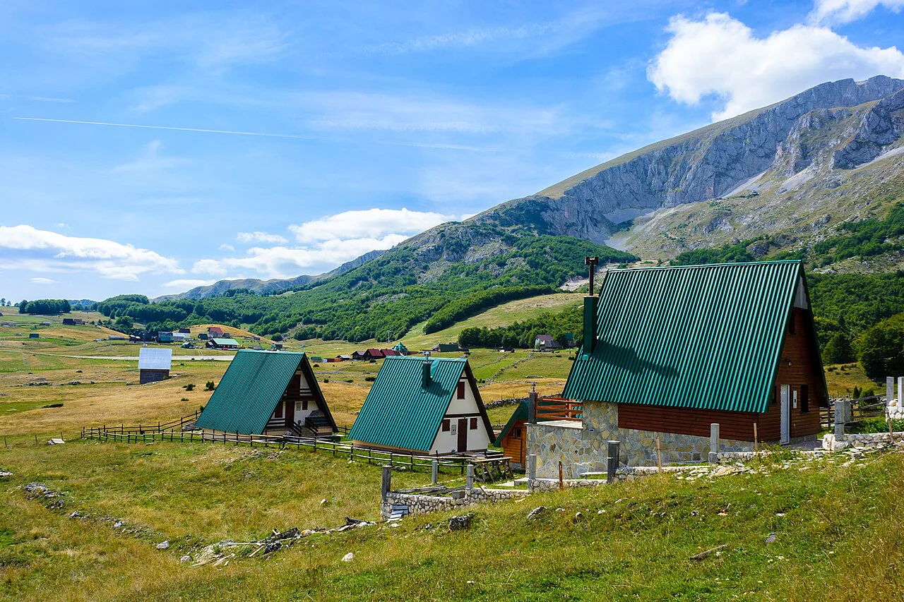 Wooden huts below the mountains near Žabljak.